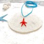 Handmade children's pendant with a red starfish made of brass and enamel