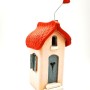 Ceramic handmade house with a red roof and a heart-shaped chimney