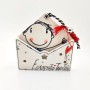 A handmade ceramic house-card holder with the message "Thank you so much"