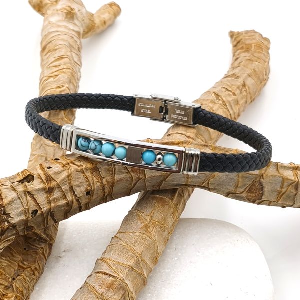 Ανδρικό  βραχιόλι που συνδυάζει μαύρα πλεγμένα δέρματα με τυρκουάζ πέτρες και μεταλλικά στοιχεία από ατσάλι